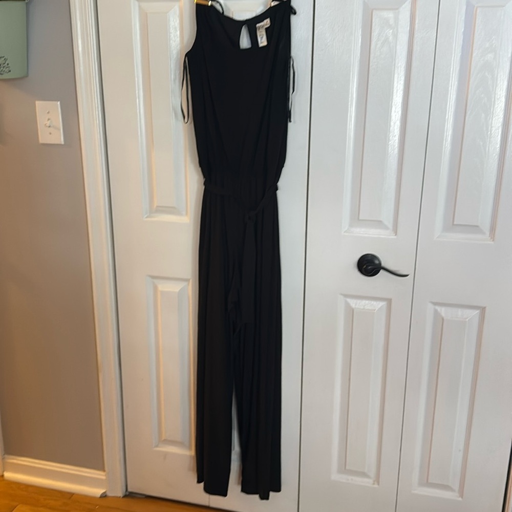 Sleeveless black pantsuit.